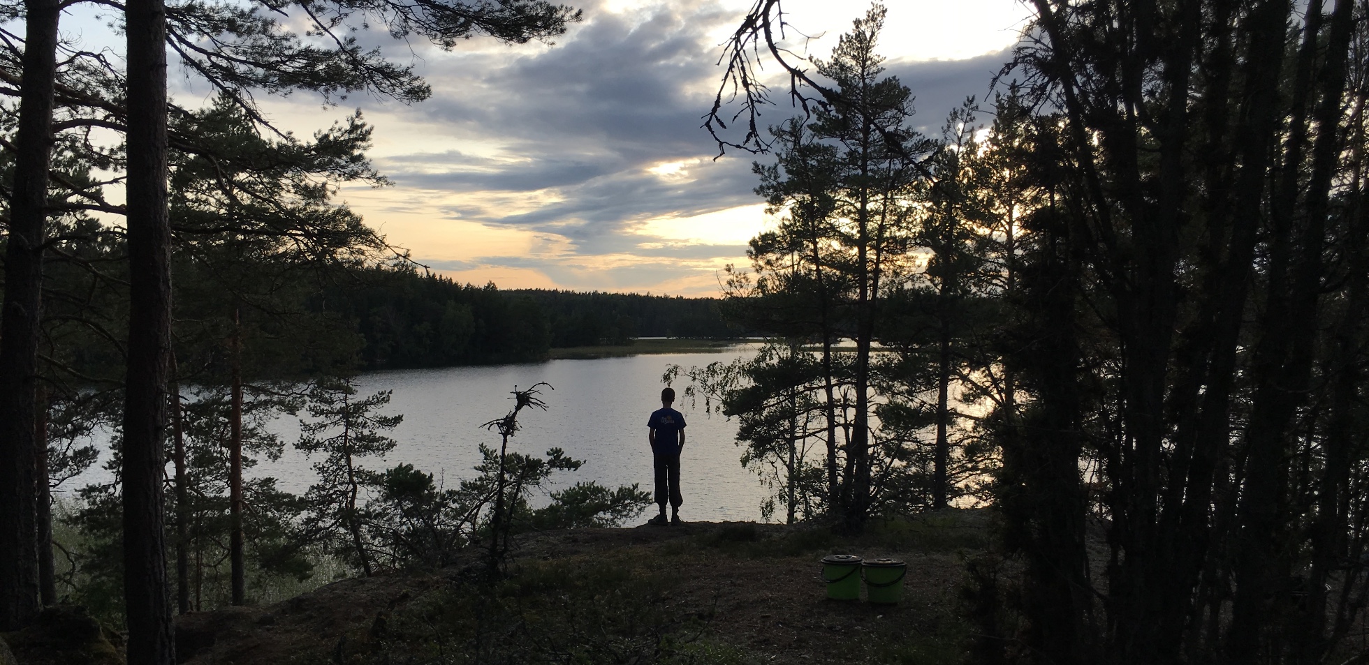 Person standing by lake