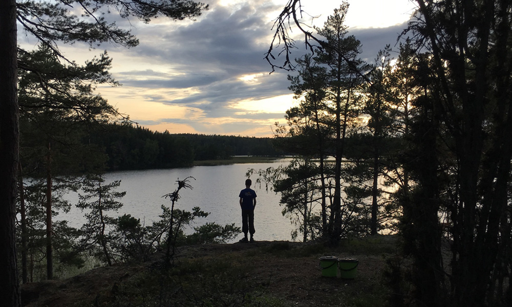 Person standing by lake